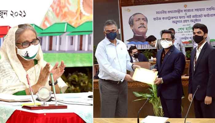 প্রধানমন্ত্রীর মুখ্যসচিব ড. আহমদ কায়কাউসের হাতে প্রধানমন্ত্রীর করোনা সহায়তা তহবিলে ৩ কোটি টাকার চেক তুলে দিচ্ছেন ওয়ালটন হাই-টেক ইন্ডস্ট্রিজ লিমিটেডের ব্যবস্থাপনা পরিচালক প্রকৌশলী গোলাম মুর্শেদ। গণভবন থেকে ভিডিও কনফারেন্সের মাধ্যমে অনুষ্ঠানে অংশ নেন প্রধানমন্ত্রী শেখ হাসিনা প্রধানমন্ত্রীর মুখ্যসচিব ড. আহমদ কায়কাউসের হাতে প্রধানমন্ত্রীর করোনা সহায়তা তহবিলে ৩ কোটি টাকার চেক তুলে দিচ্ছেন ওয়ালটন হাই-টেক ইন্ডস্ট্রিজ লিমিটেডের ব্যবস্থাপনা পরিচালক প্রকৌশলী গোলাম মুর্শেদ। গণভবন থেকে ভিডিও কনফারেন্সের মাধ্যমে অনুষ্ঠানে অংশ নেন প্রধানমন্ত্রী শেখ হাসিনা